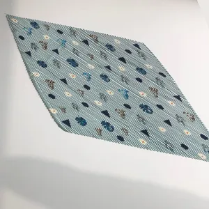 Close up detail of pleated square scarf featuring geometric abstract print for women spring fashion