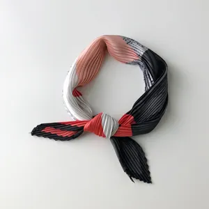 Detailed view of Korean style pleated square scarf with stylish geometric print for women.