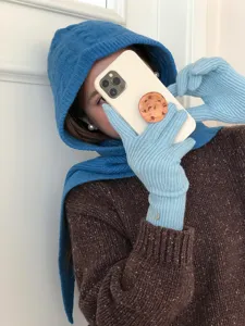 Cozy blue knit balaclava hooded scarf and warm winter matching gloves set apparel detail view.