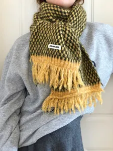Cozy winter women's plaid tassel scarf, soft knitted warm neck wrap for daily wear.