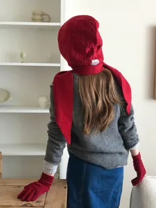 Red knit balaclava scarf combo detail showing cozy cable texture and warm winter wear style.