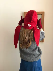 Red knitted balaclava hat and scarf set with gloves, warm winter fashion accessory for women.