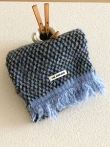Cozy blue houndstooth tassel scarf detail, soft winter warm fashion accessory for women.