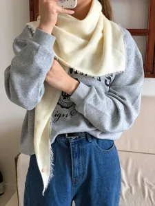 Cozy wool-blend solid color triangular scarf, stylish fringed wrap for winter daily wear.