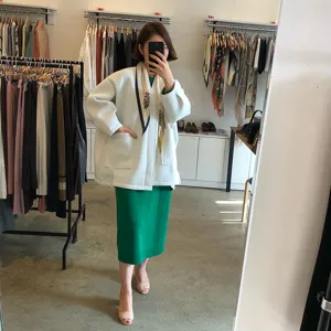 Women fashion floral print decorative small scarf with knit cardigan and green dress set.