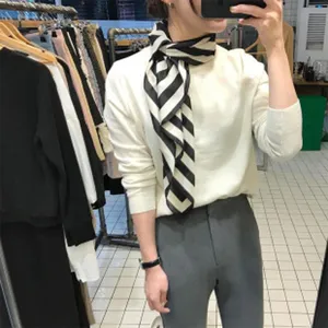 Black and white striped silk-like square scarf for professional wear or daily styling.
