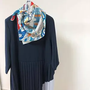Silk square scarf with equestrian horse print, elegant neck wrap accessory for women.