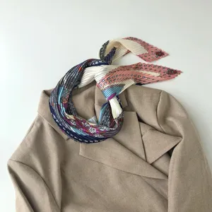 Pleated geometric print silk scarf detail, elegant neckerchief for women stylish wear.