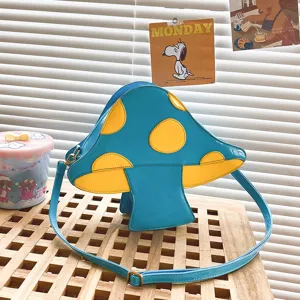 Blau-gelbe Pilz PU Leder Umhängetasche, süßes ausgefallenes Design, detailgetreue Nahaufnahme.