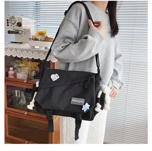Casual black canvas messenger bag for students, versatile Harajuku style large capacity.