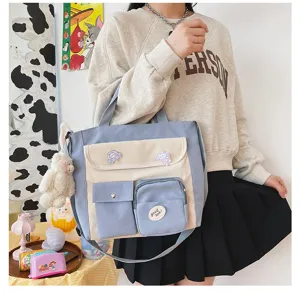 Canvas shoulder bag multi-pocket crossbody student casual cute tote bag for daily use.