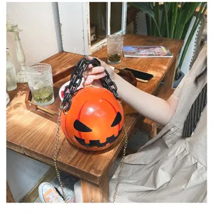 Halloween spooky pumpkin round crossbody bag with chunky black chain and stylish shoulder strap