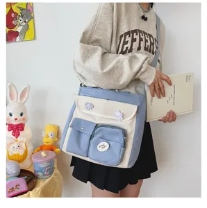 Detailed view of the canvas multi-pocket crossbody bag with chic color block design for daily use.