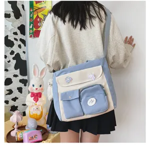 Korean style canvas crossbody bag with contrast color design, multiple pockets and cute badges.