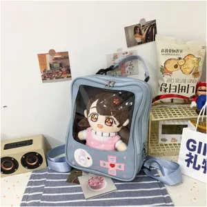 Lindo mochila transparente de PU estilo japonés con bordado de cruz de gamepad y ventana.