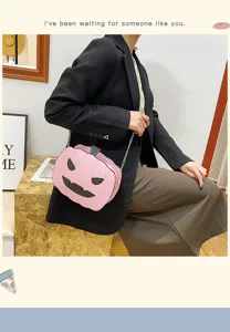 Pink pumpkin PU leather crossbody bag with chain strap, cute Halloween novelty shoulder bag.