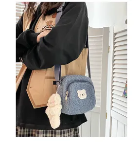 Cute fuzzy fleece crossbody bag for women, trendy vintage bear plush shoulder bag with cute pendant.