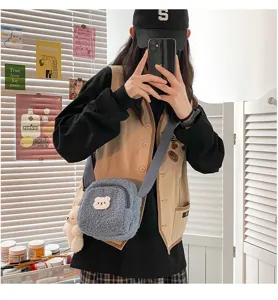 Cute lamb wool crossbody bag with fluffy bear plush pendant, soft Japanese style detail.