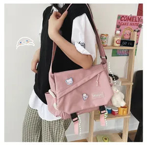 Pink harajuku canvas messenger bag casual student crossbody bag with cute plush pendant.