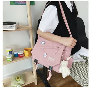 Japanese style Harajuku canvas messenger bag, cute pink student crossbody bag with bear pendant.