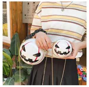 Halloween pumpkin devil round crossbody bag with chunky black chain and stylish acrylic design.
