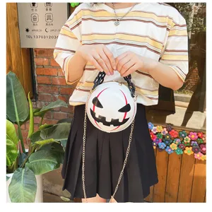 Halloween pumpkin devil round women crossbody bag with black acrylic chain and stylish metal strap.