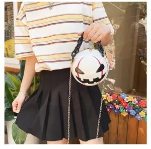 Detailed view of the creative Halloween pumpkin demon round cross-body bag with chain.