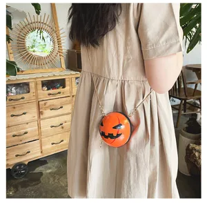 Detail view showcasing the creative Halloween pumpkin round acrylic crossbody chain bag.