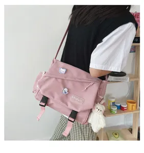 Pink canvas messenger bag Japanese style casual cross body bag with cute bear pendant.