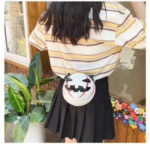 Detail view of the Halloween pumpkin acrylic crossbody chain bag, novelty demon purse design.