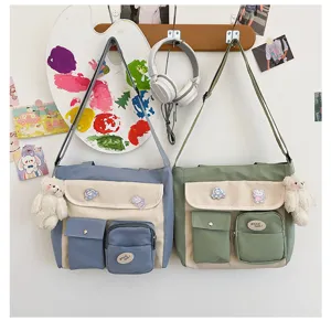 Canvas crossbody shoulder bag details with multi-pockets, cute bear pendant and pins.