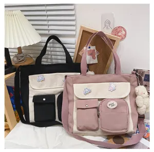 Canvas shoulder bag for students, aesthetic crossbody tote with cute bear pins and multi pockets.