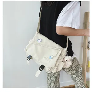 Japanese Harajuku minimalist casual student canvas crossbody bag with large capacity for daily use.