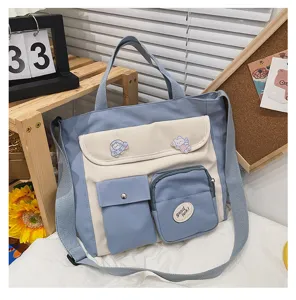 Canvas crossbody shoulder bag with multiple pockets and cute pins for daily student use.