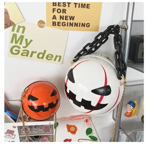 Halloween round pumpkin demon crossbody bag with chunky acrylic chain for women detail view.
