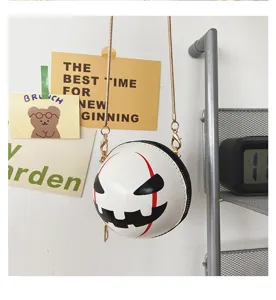 Halloween pumpkin demon round crossbody bag with chain detail, unique festive fashion handbag.