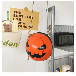 Halloween pumpkin round crossbody bag with chain strap, funny novelty shoulder bag for women.