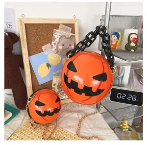 Halloween pumpkin round crossbody bag with chunky acrylic chain, trendy funny novelty purse for women.