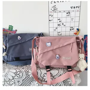 Japanese style canvas messenger bag, large capacity student casual crossbody bag details.
