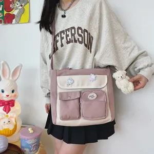 Detailed view of vintage canvas crossbody bag, cute multi-pocket student shoulder bag.
