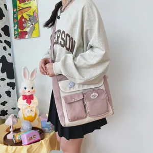 Canvas crossbody bag featuring multi pockets, cute color block design for casual daily students.