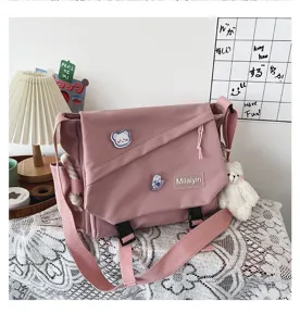 Pink Japanese Ins style casual student messenger bag, large capacity canvas crossbody bag for daily use.