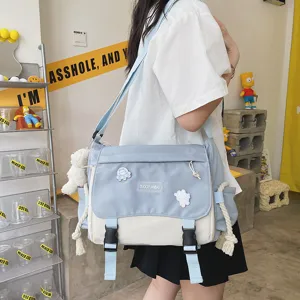 Japanese style colorblock messenger bag casual student canvas crossbody bag for daily use.