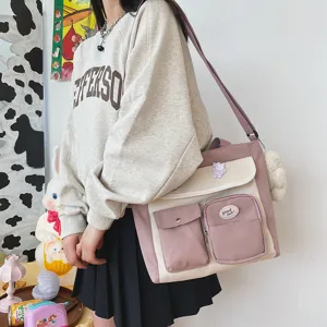 Korean style canvas crossbody bag with multi-pockets, cute pink and white design for students.