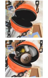 Orange spherical shoulder bag detail showing glossy texture, chunky chain and interior capacity.