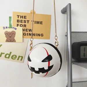 Halloween devil round crossbody bag with metal chain, funny novelty shoulder handbag for women.