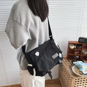 Japanese Harajuku casual black messenger bag for students, large capacity cross body style.