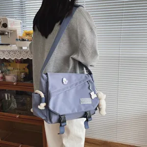 Casual grey canvas crossbody messenger bag for students, large capacity daily use. - detail view
