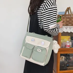 Korean vintage canvas crossbody bag for women, multi-pocket cute student shoulder bag.