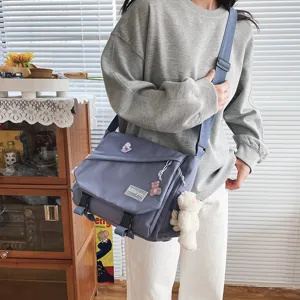 Casual Harajuku canvas messenger bag for students, large capacity crossbody bag with pins.